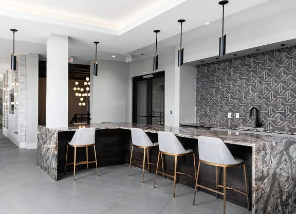 Multi-Use Community Lounge with Game Tables and Bar Area