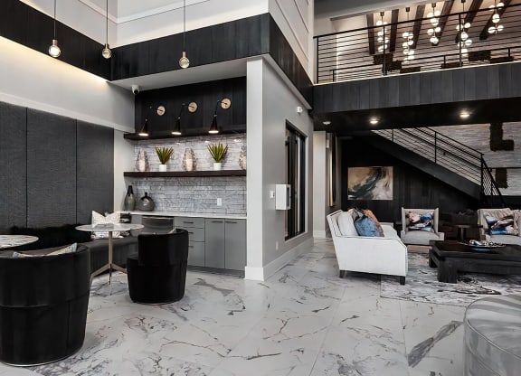 Community Lounge Featuring High Ceilings and Marble Floors
