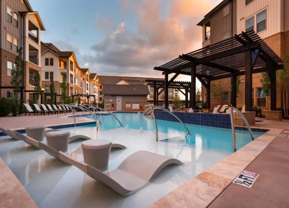 Spacious Pool Area with Ample Seating and Modern Landscaping