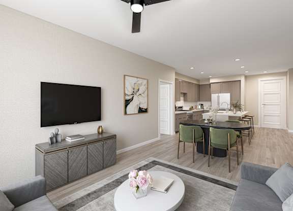 a living room and dining room with a tv and a kitchen