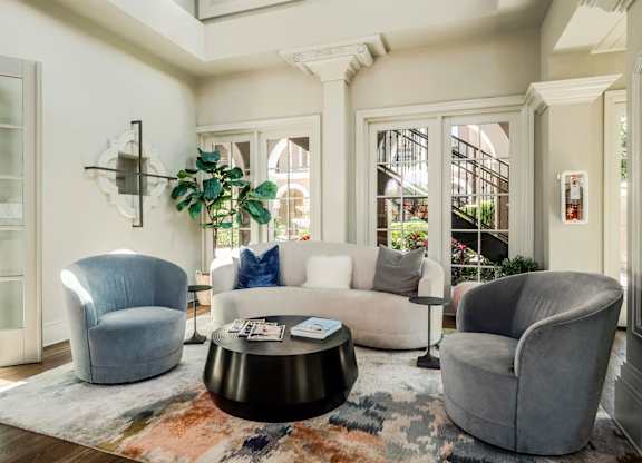 Modern clubhouse lounge with comfortable seating and natural light creating a welcoming atmosphere.