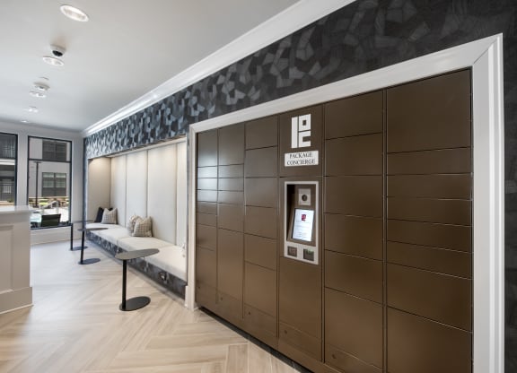 the mail center with package lockers and a bench for seating