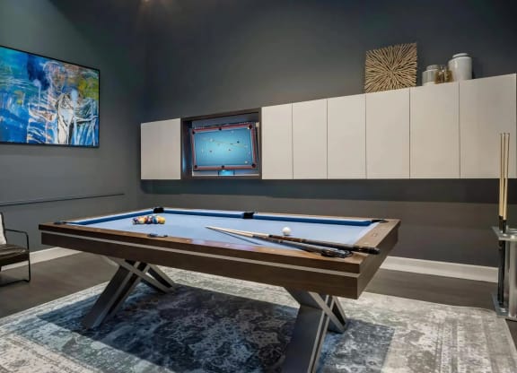 Private Game Room with Pool Table and Wall-Mounted Art