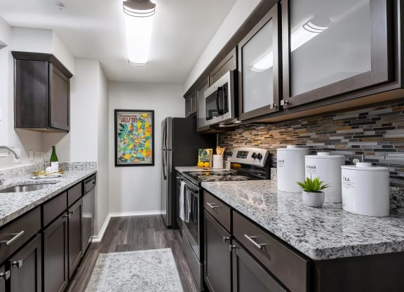 Mesa Verde Kitchen Upgraded Kitchen with Granite Countertops Shaker Cabinets Stainless Appliances Decorative Backsplash