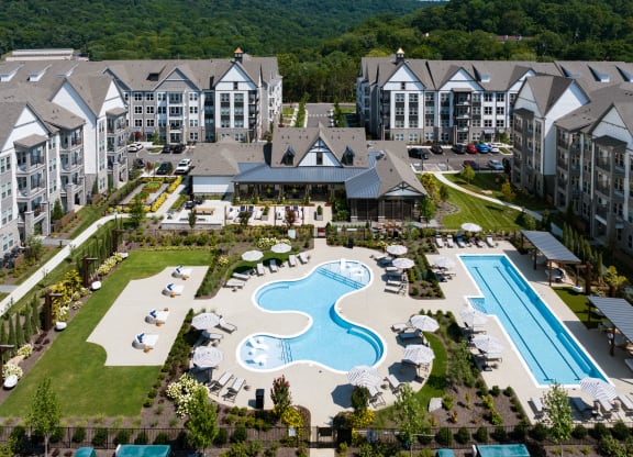 an aerial view of the resort with a swimming pool