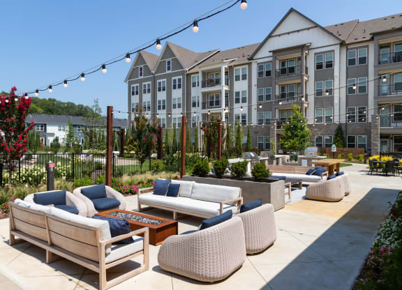 Open Air Patio featuring an Outdoor Kitchen, Fire Pit and Seating Areas