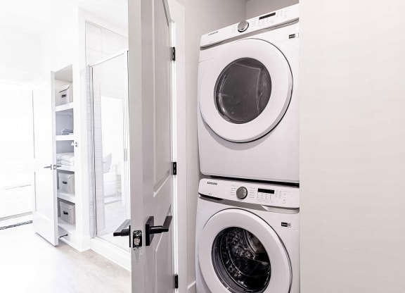 Modern bathroom with convenient in-unit washer and dryer at Novel Cary