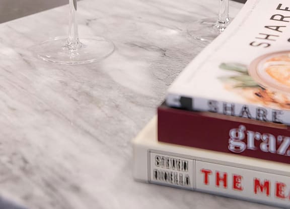 Access to hand-selected glassware and reading material in public areas at Novel Cary