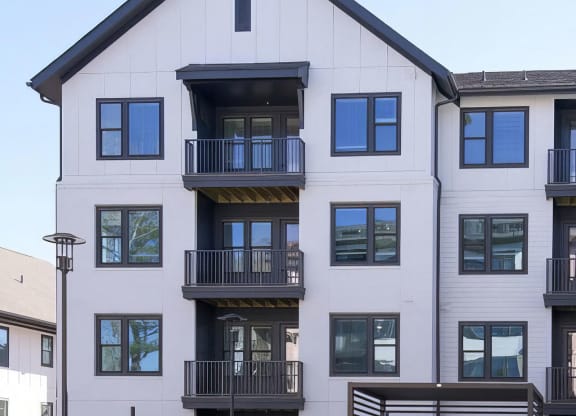 Apartments with balconies overlooking the beautiful pool area at Novel Cary