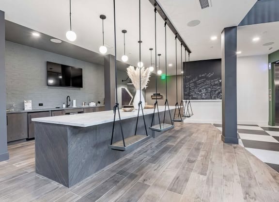 Counter area with interior swing seating, full wet bar, and chalkboard at Novel Cary