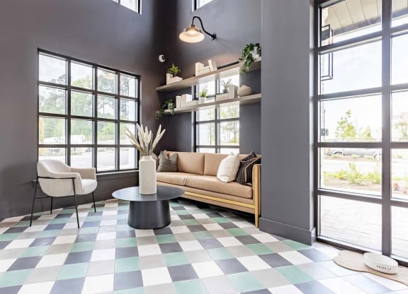 Cozy entryway with cozy seating area and pet water bowl at Novel Cary