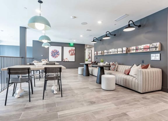 Cozy reading area with extra large sofa and magazine rack at Novel Cary