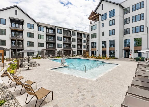 Incredible inground saltwater pool with abundant seating at Novel Cary