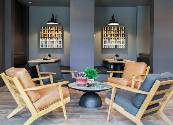 a seating area with chairs and a table in a room