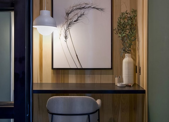 Private office area with desk and comfortable seating at Novel Cary