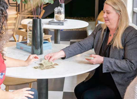 Social space with a variety of tabletop games and cards at Novel Cary