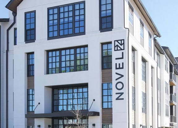 Welcoming farmhouse-style entryway to the apartments at Novel Cary