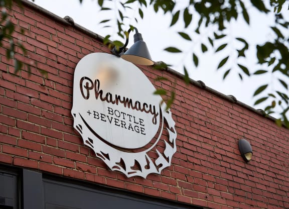Stop by the local Pharmacy Bottle + Beverage for a drink near Novel Cary