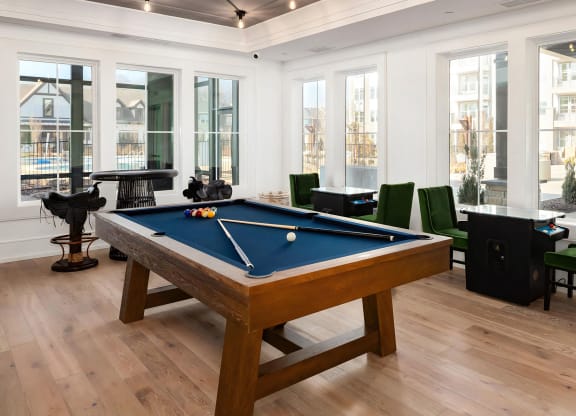 Social game room with pool table and arcade tables