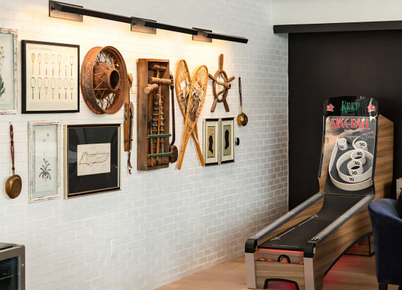 Social game room with pool table, skee ball machine and arcade tables
