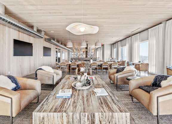 A modern living room with a wooden floor and furniture.