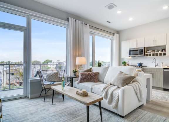 A modern living room with a view of the city.