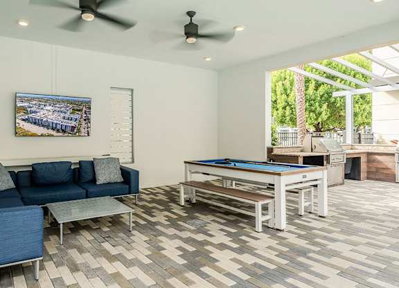 Interior tenant lounge with pool table at Pearl Flagler Village