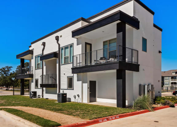 Expansive Outdoor Patios and Bold Black Trim Detailing at Rhythm Apartments