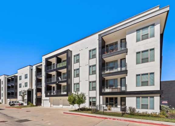 Rhythm Apartments Exterior Featuring Private Balconies and Garage Access