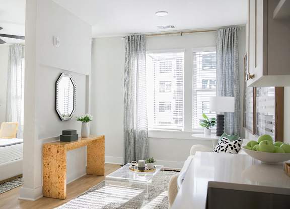 Bright and modern studio space with tall ceilings and abundant natural light at Novel Cary