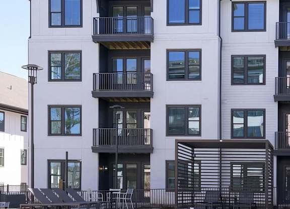 Apartments with balconies overlooking the beautiful pool area at Novel Cary