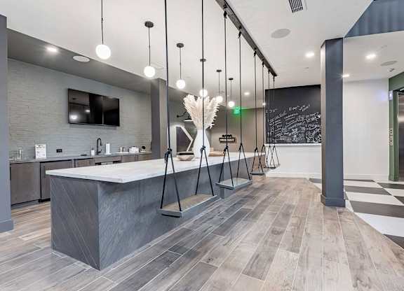 Counter area with interior swing seating, full wet bar, and chalkboard at Novel Cary