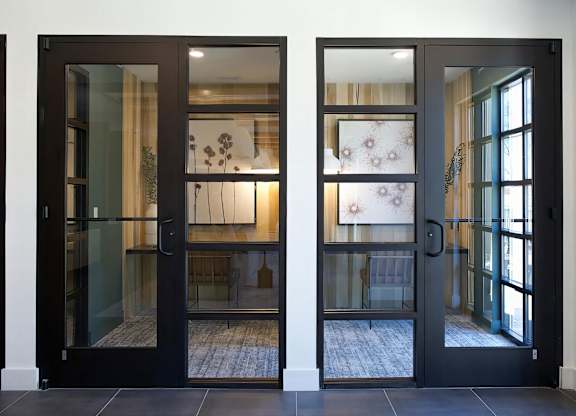 Multiple private office areas with desks and cozy lighting at Novel Cary