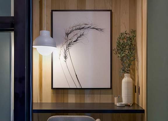 Private office area with desk and comfortable seating at Novel Cary