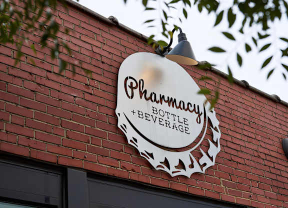 Stop by the local Pharmacy Bottle + Beverage for a drink near Novel Cary