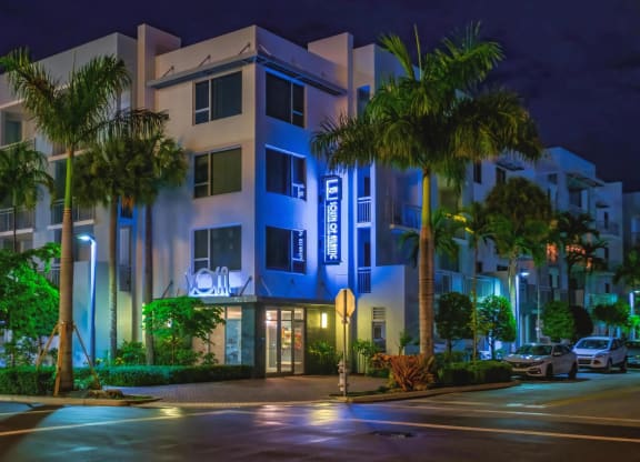 Evening View of South of Atlantic Luxury Apartments with Vibrant Blue Accent Lighting