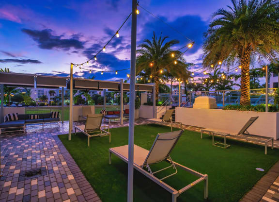Relaxing Patio with Lounge Chairs and Sunset Sky at South of Atlantic