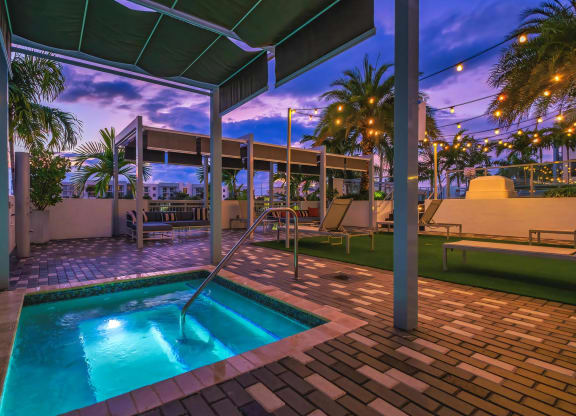Tranquil Spa Tub Under Canopy and String Lights at South of Atlantic