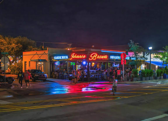 High-Energy Night Scene Featuring Music and Burgers at Johnnie Brown’s