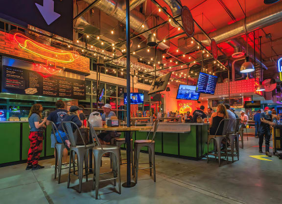 Bustling Bar Scene with String Lights and Social Vibe Close to South of Atlantic