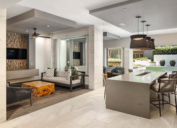 Indoor Lounge Space with Dining Island and Outdoor Courtyard Access