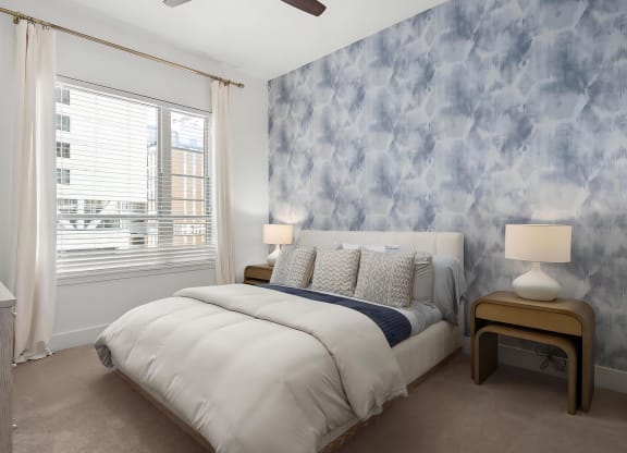 Spacious Bedroom with King Bed, Dark Accent Wall, and Elegant Lighting