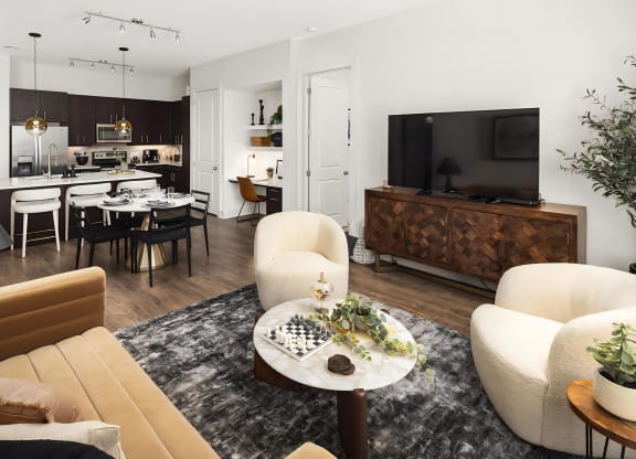 Open Living Room and Kitchen Area With Dining and Workspace Setup