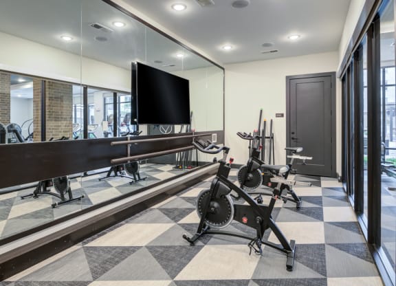 Dedicated Spin and Barre Room With Floor-to-Ceiling Mirrors
