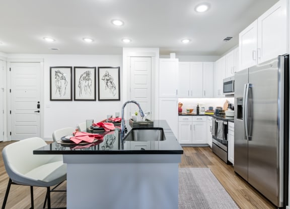 Modern Kitchen With Stainless Steel Appliances and Bar Seating