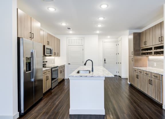 Open-Concept Kitchen With Built-In Wine Storage and Ample Cabinetry