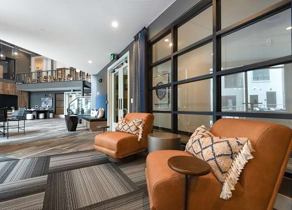 Open-Concept Common Area with Stylish Seating and Lofted Walkways