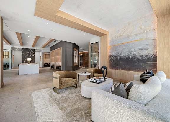 Lobby lounge with curated artwork, plush seating, and refined modern design