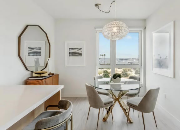 Cozy Dining Nook with Glass Table and Plush Seating