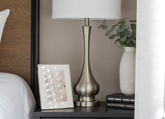 Cozy Bedside Setup with Decorative Accessories and Books